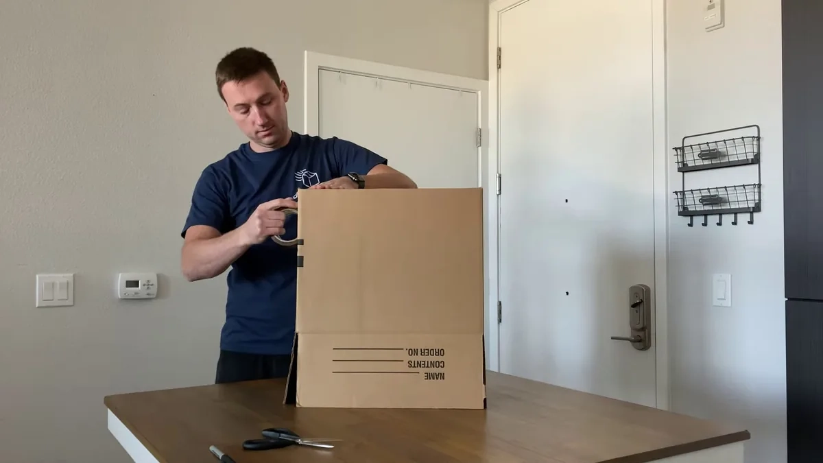 Lionheart mover sealing packed box in Shreveport